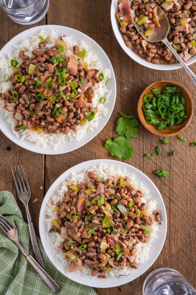 2 plates of black eyed peas with white rice