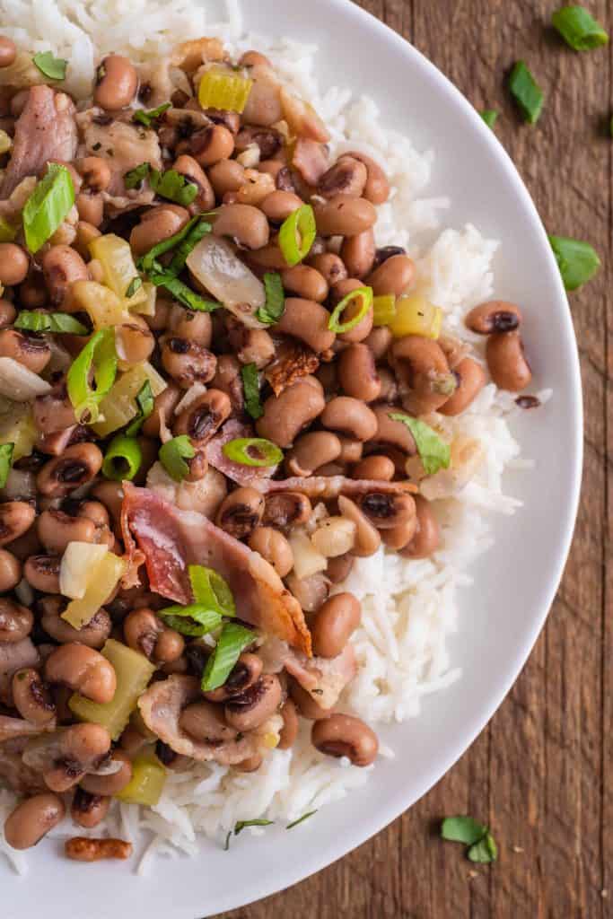 Overhead closeup view of beans over white rice.