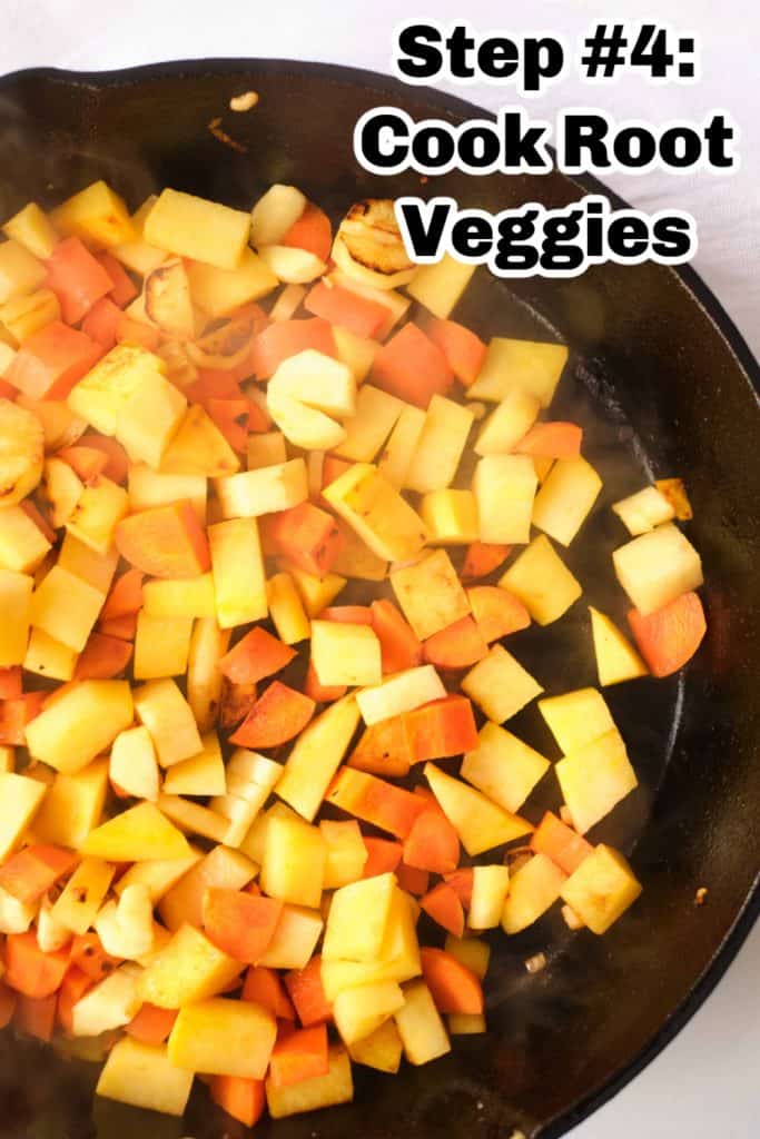 Parsnips, turnips and carrots in a black iron skillet.