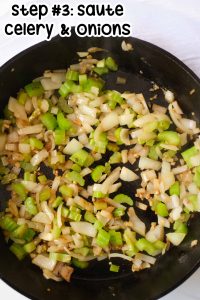 Celery and onion in a black iron skillet.