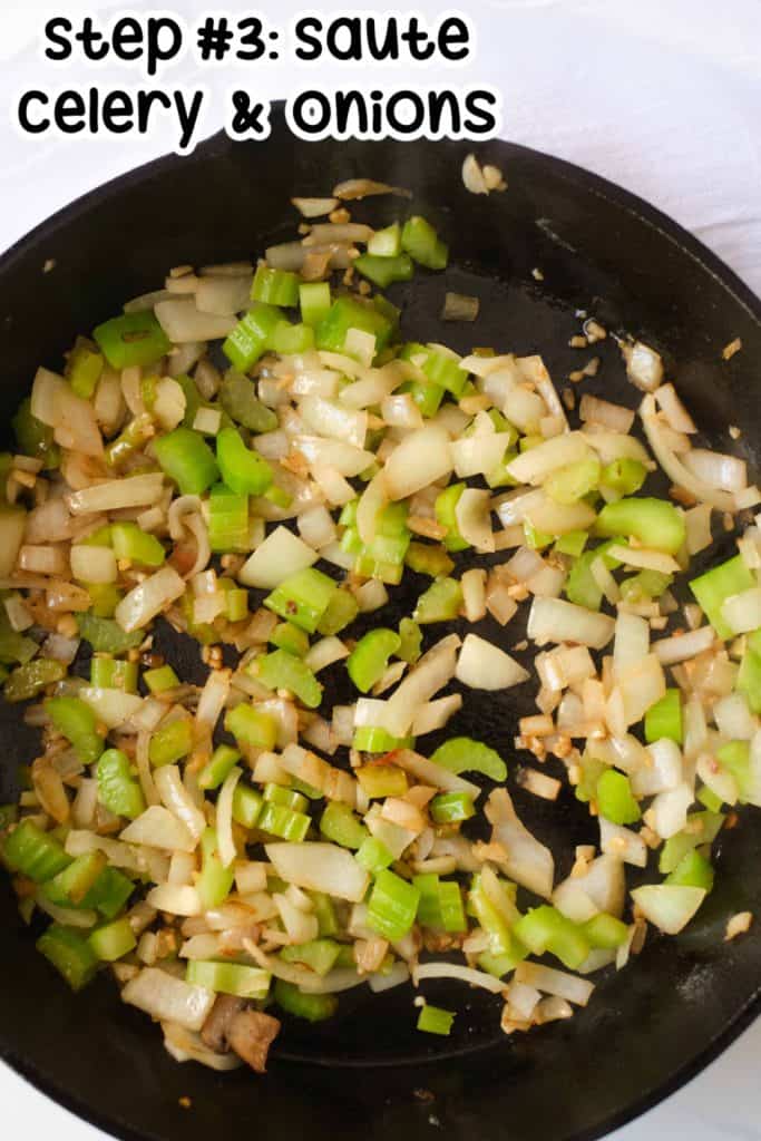 Celery and onion in a black iron skillet.