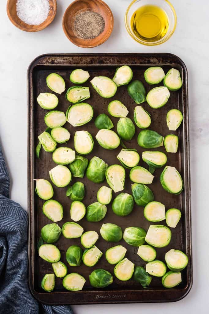 Brussels sprouts on rimmed baking sheet.