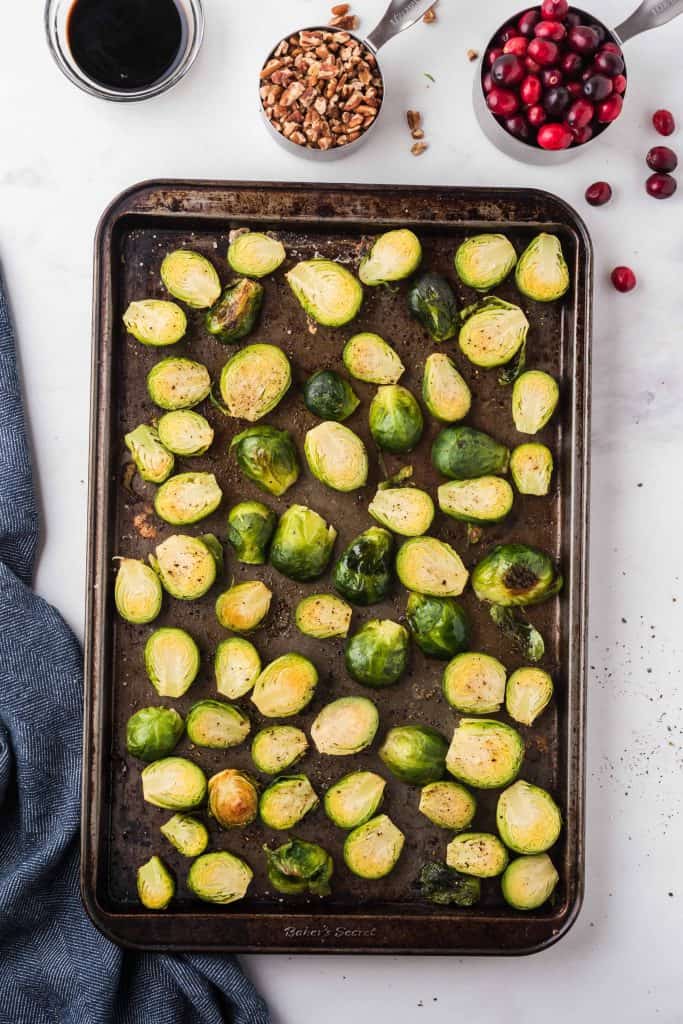 Roasted Brussels sprouts on a sheet pan.
