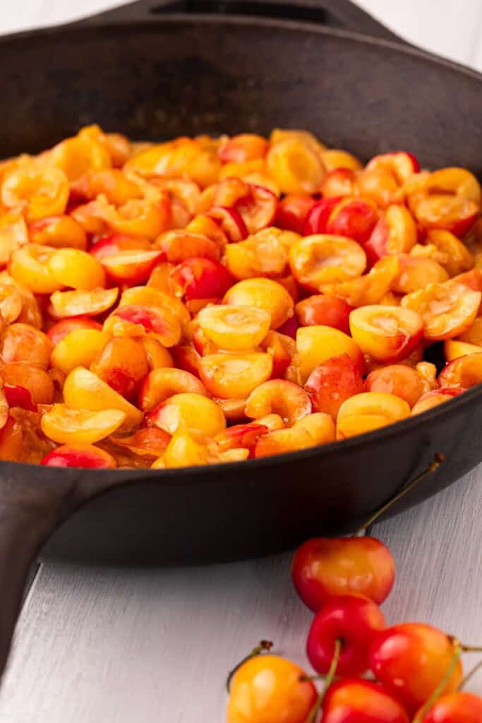 Pitted Rainier cherries tossed with cornstarch and lemon juice in a cast iron skillet