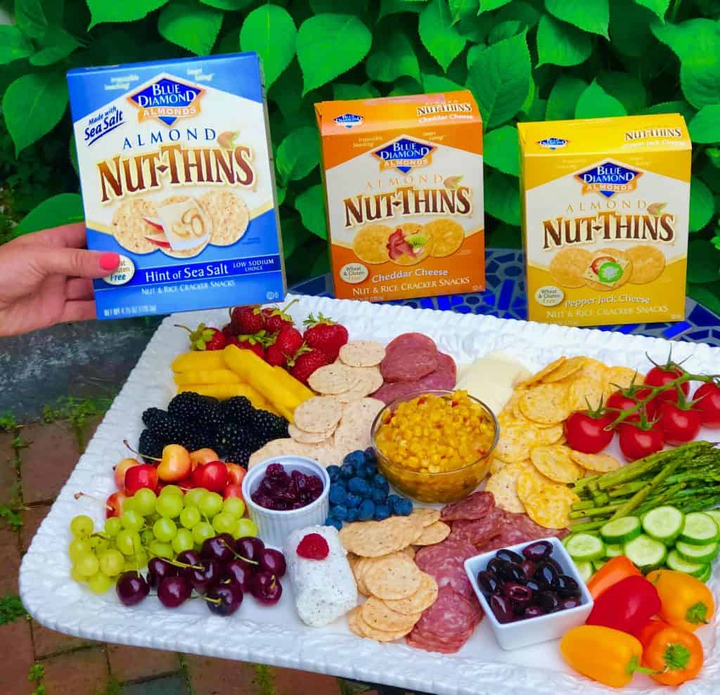 Create the perfect summer charcuterie platter: vegetables, fresh fruit, dried fruit, cheeses, cured meats, olives, salsa