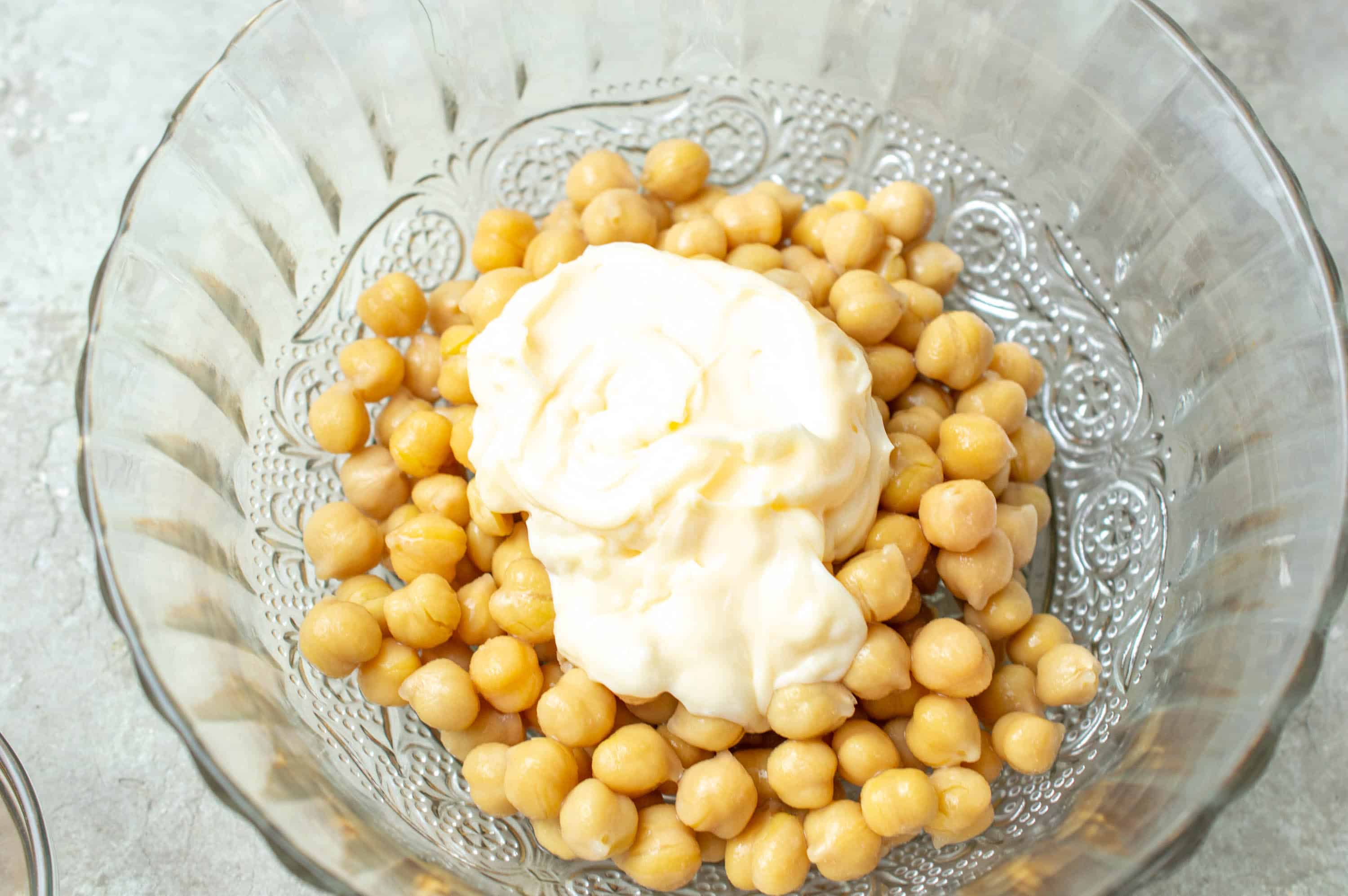 chickpeas in bowl with mayonnaise 