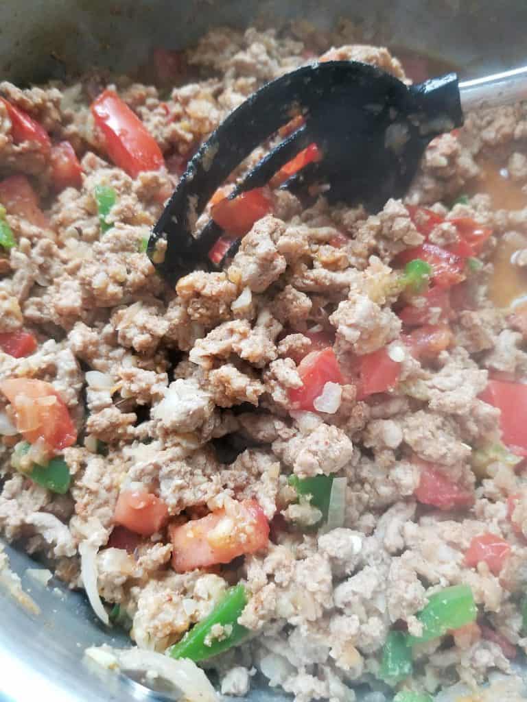 Browned turkey, onion, and jalapeño in a saute pan