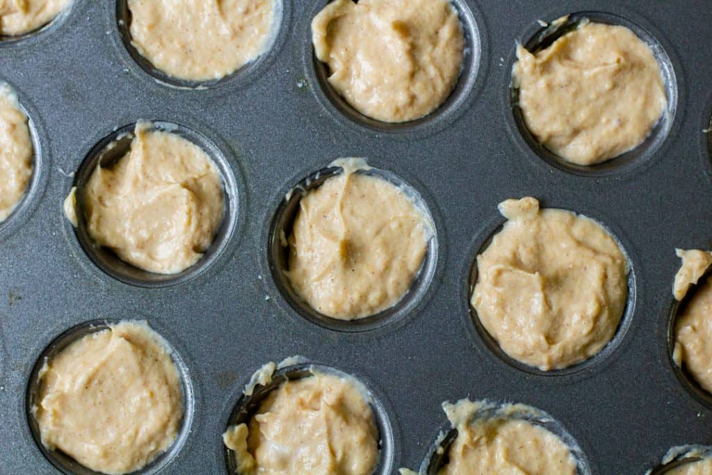 Pumpkin cheesecake bite ingredients in mini muffin tin