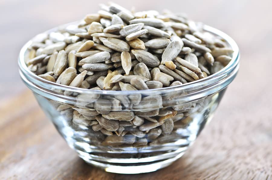 Shelled sunflower seeds close up in glass bowl