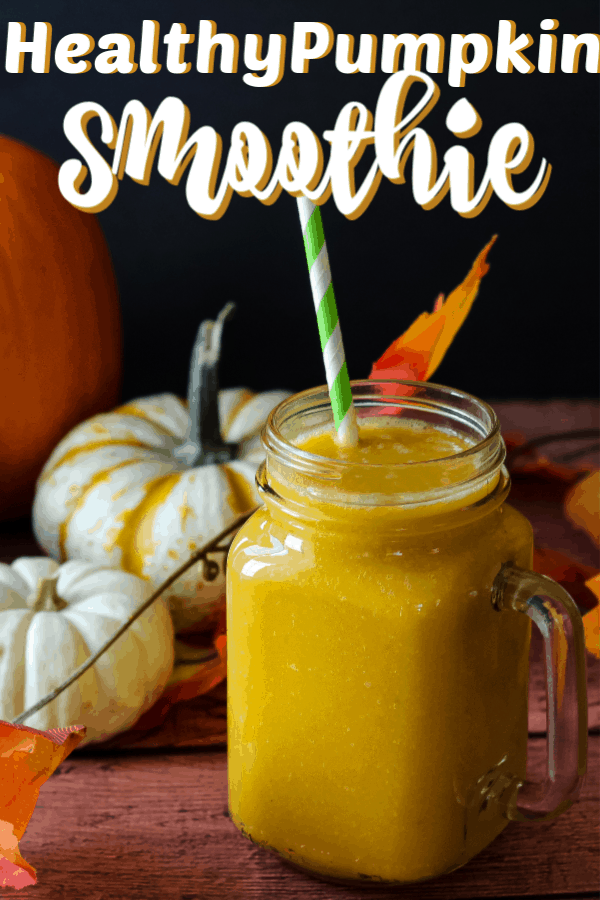 Healthy Pumpkin Smoothie with decorative pumpkins in the background