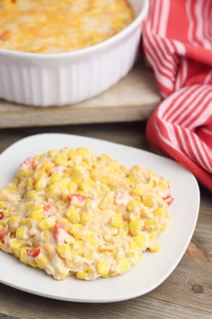 Mexican corn casserole on a white plate.