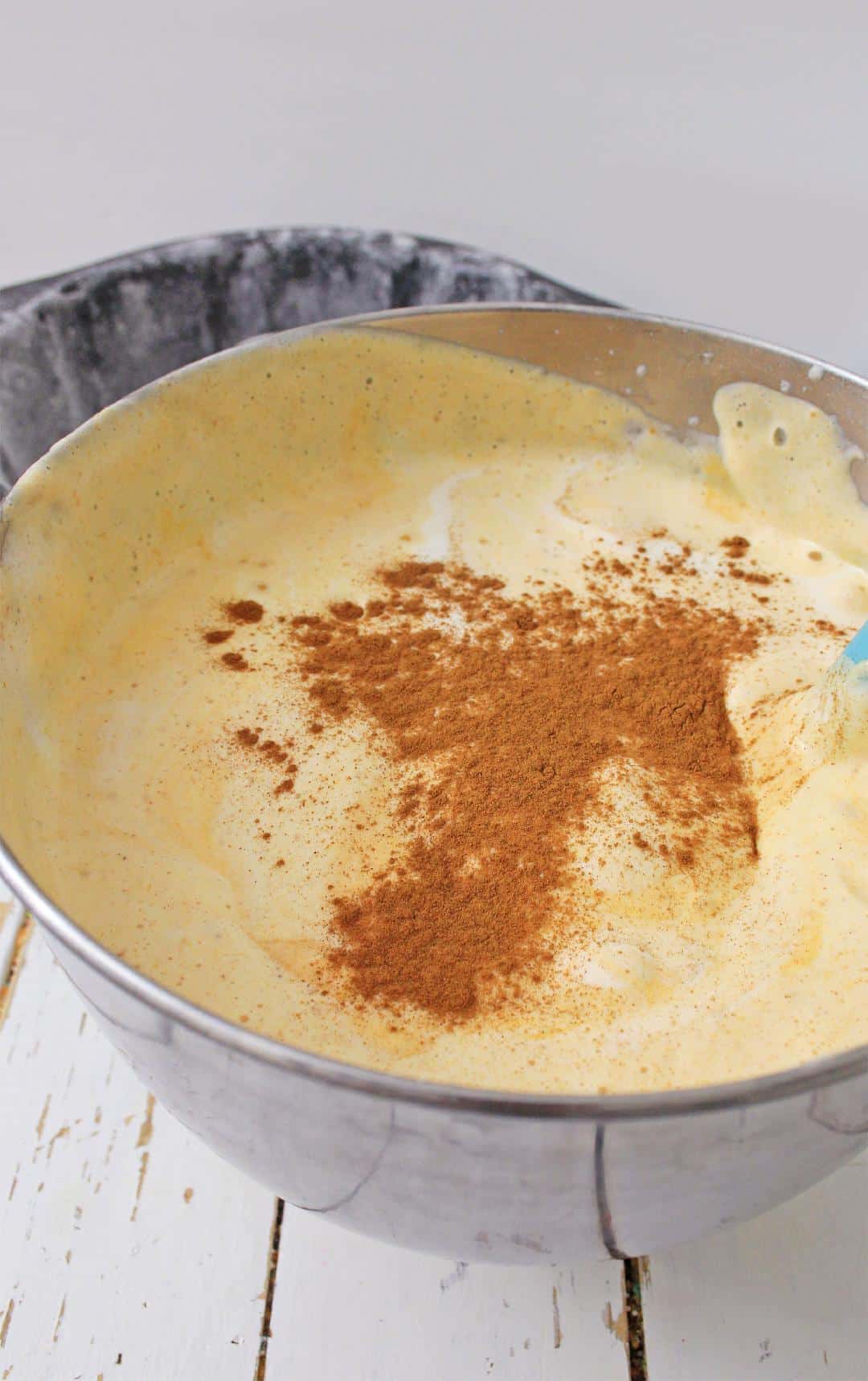 Pumpkin Angel Food Cake batter in bowl with white background 