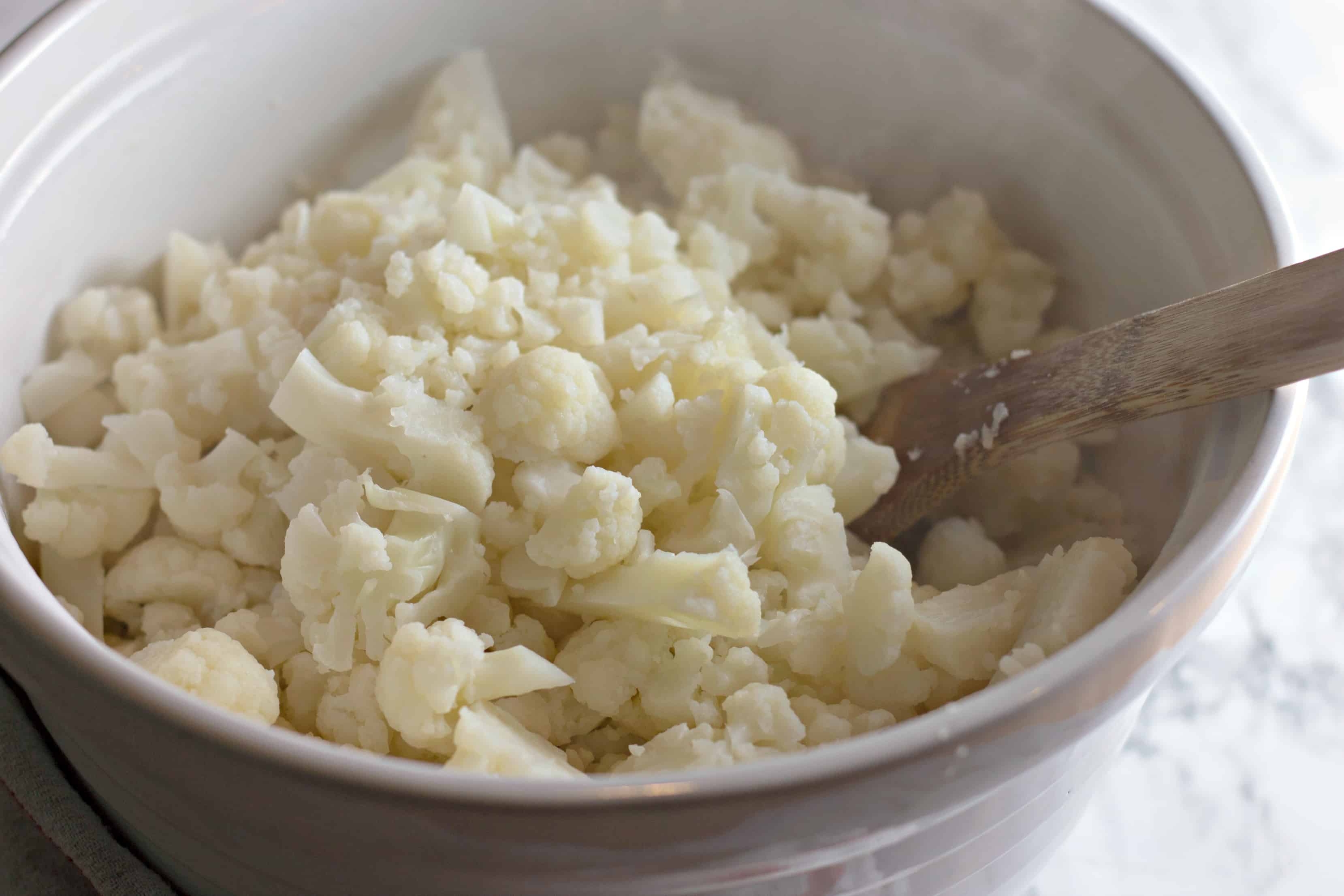 Steamed cauliflower in a white bowl