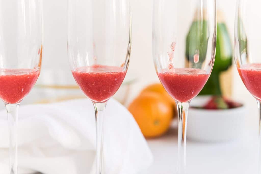 Strawberry puree in champagne flutes