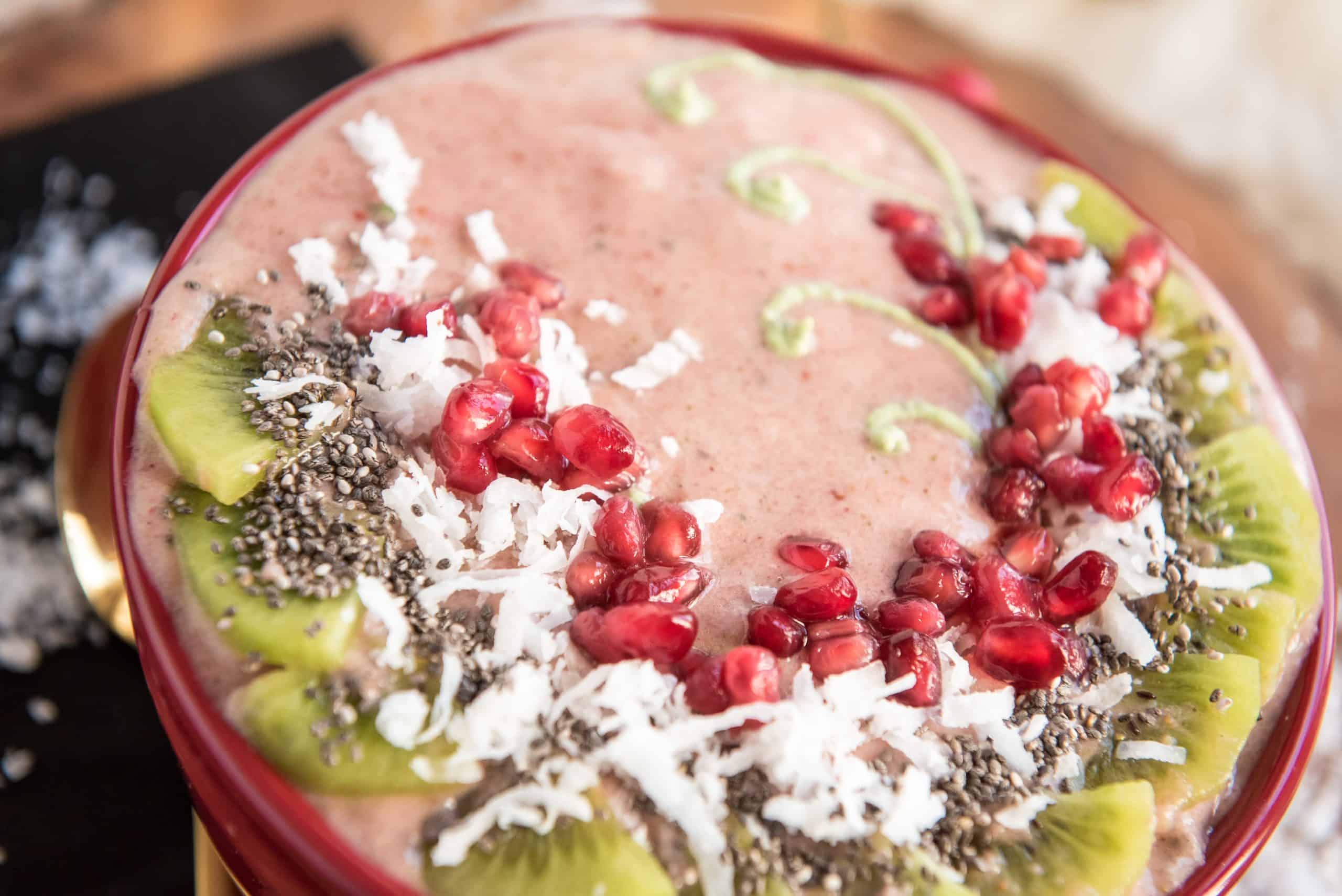 Beautifully decorated strawberry banana smoothie bowl.