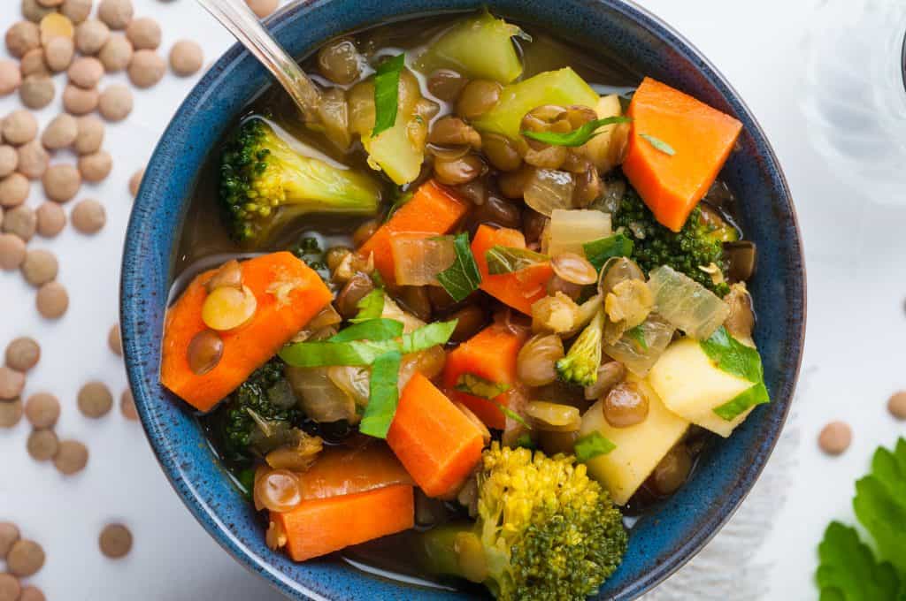 vegan lentil soup in a blue bowl.