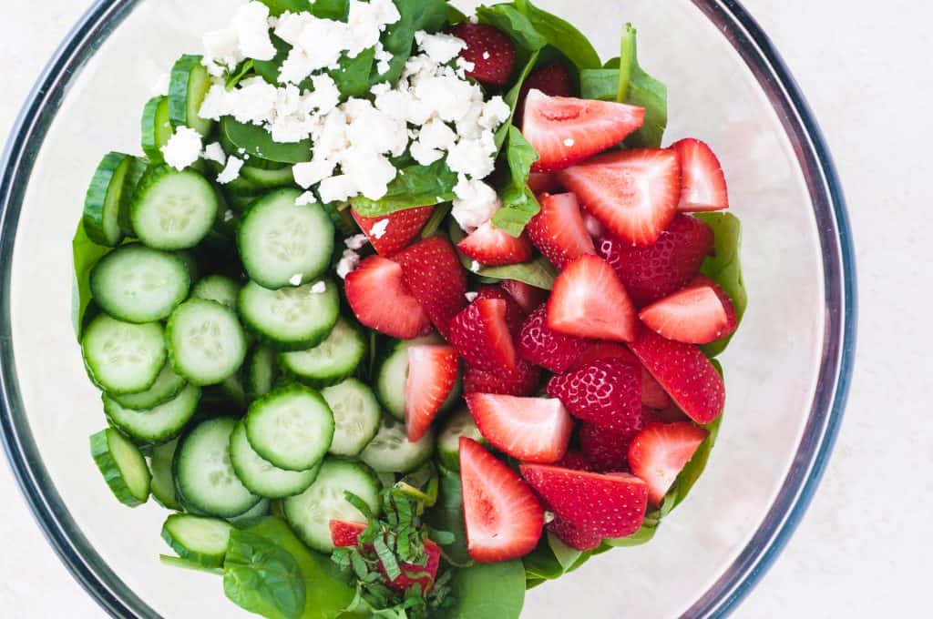 Cucumber Strawberry Salad in a glass bowl.