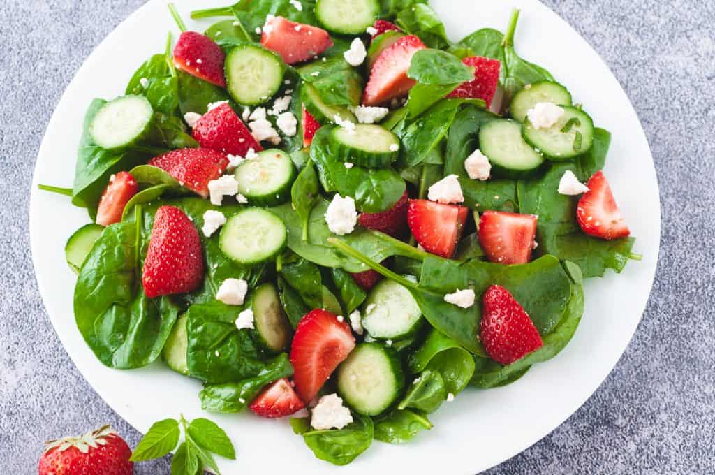 Cucumber Strawberry Salad in a white bowl.