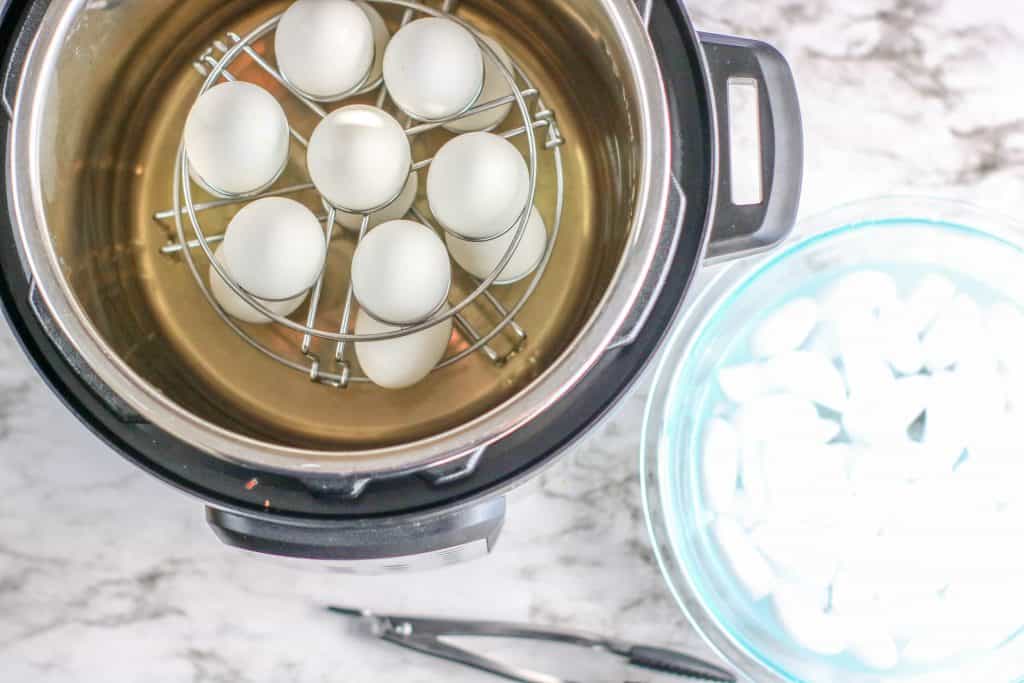 Instant Pot with eggs beside an ice bath.