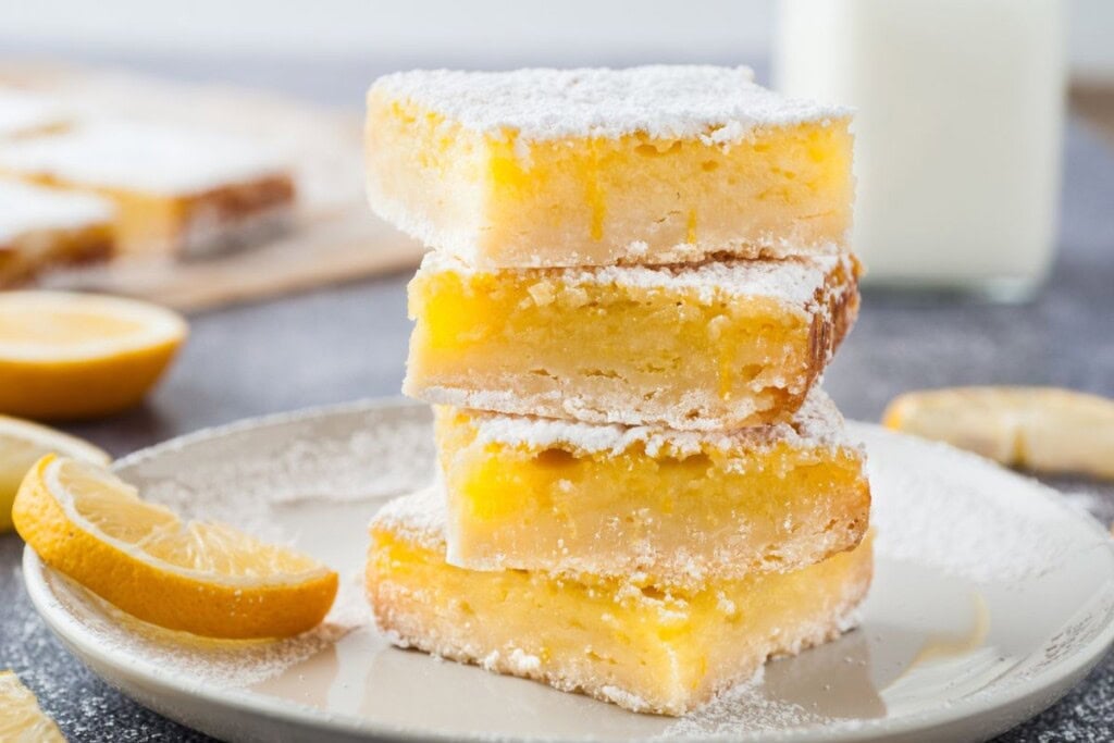 3 Lemon Shortbread Squares stacked on top of each other.
