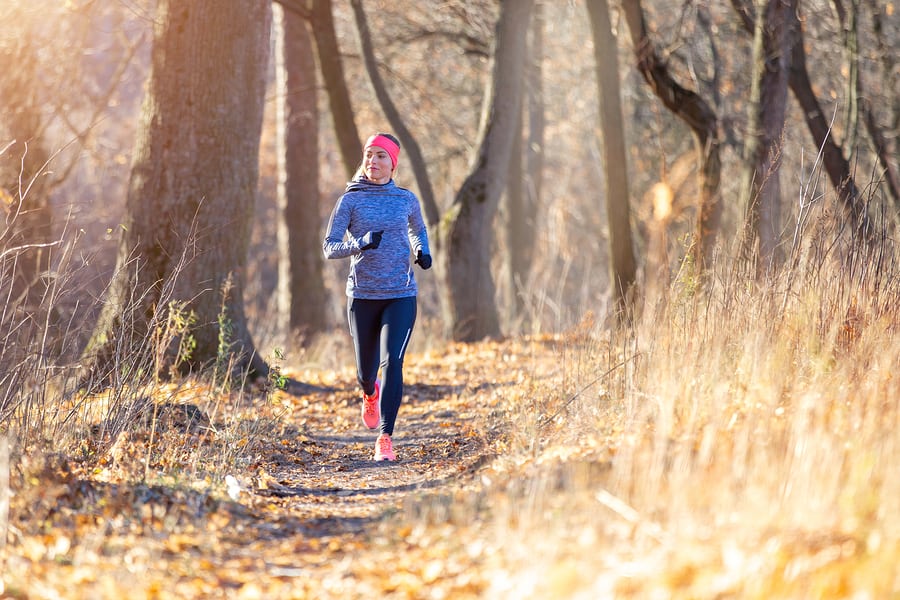 Young fitness woman running in the park