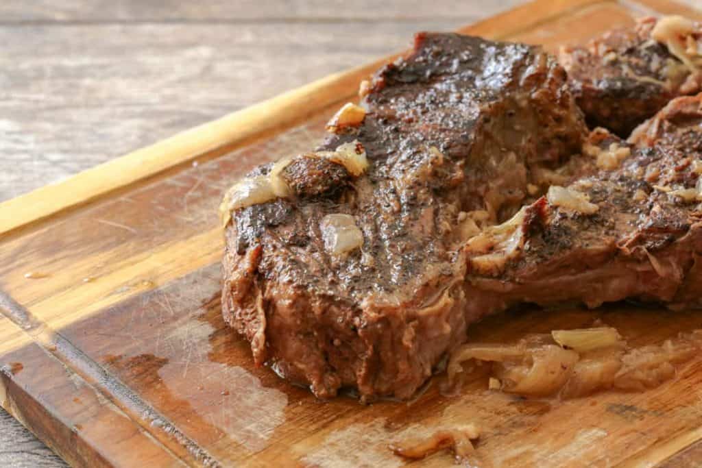 French dip beef on a cutting board.