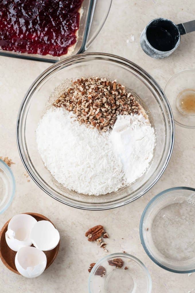 flour, pecans, coconut in bowl