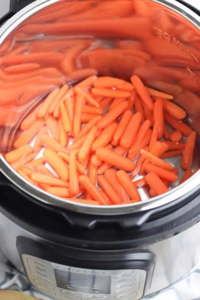 Baby carrots in Instant Pot with water.