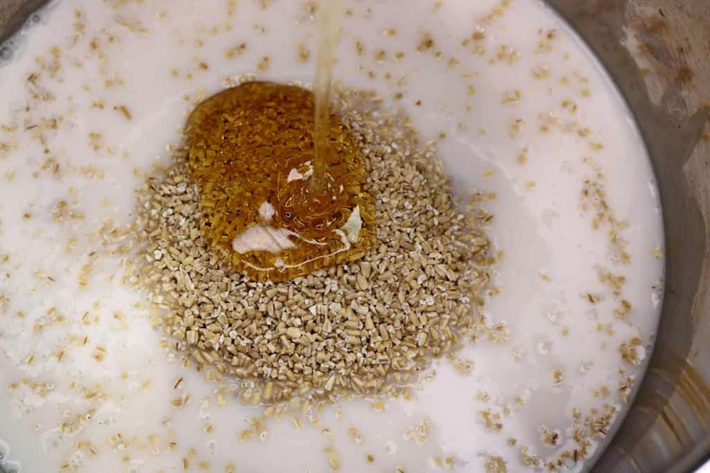 Honey being poured on top of oats in Instant Pot