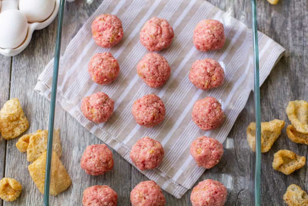 Swedish meatballs lined up uncooked