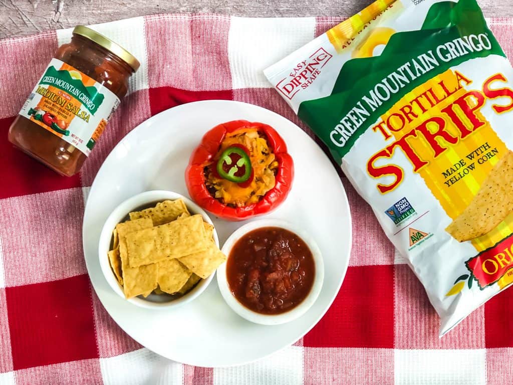 Overhead shot of Green Mountain Gringo Salsa, Chips and stuffed Bell Pepper.