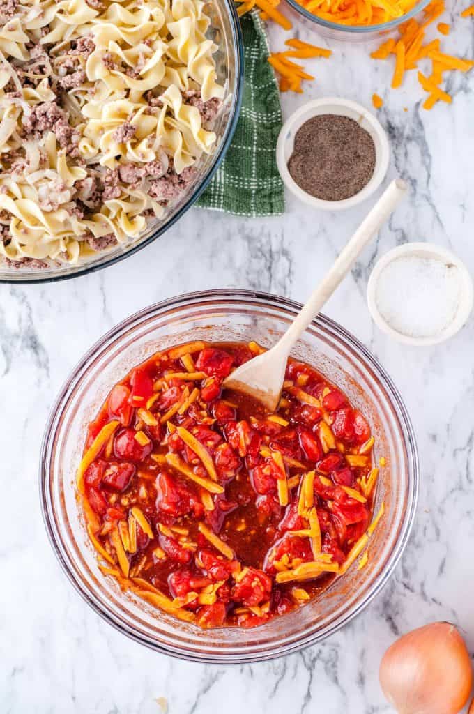 Cheese stirred into the tomato spice mixture for the beef and noodle casserole