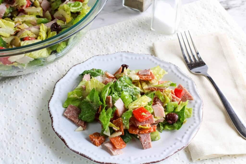 Serving of chopped Italian salad on a white plate.