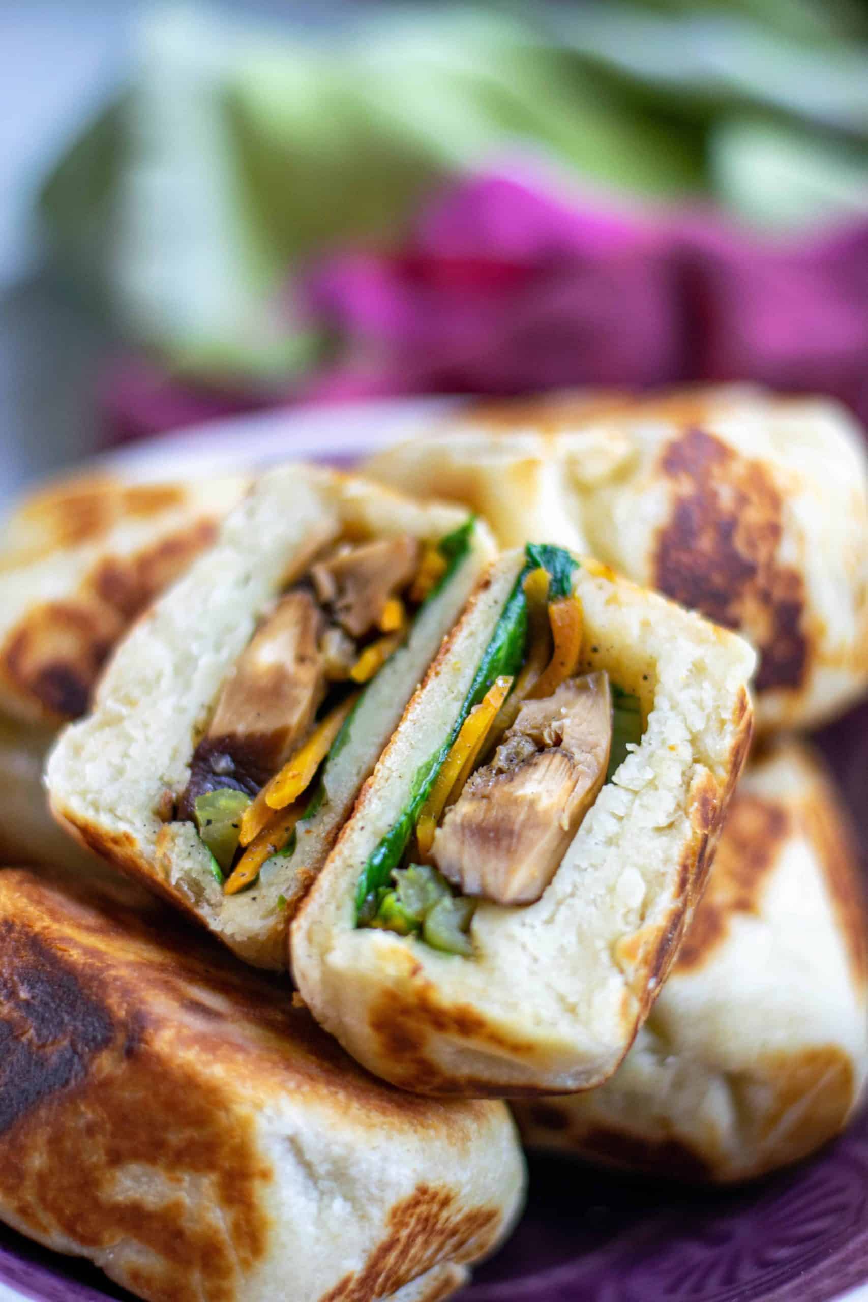 Vegan bao bun cut in half to see the Shitake mushroom filling.