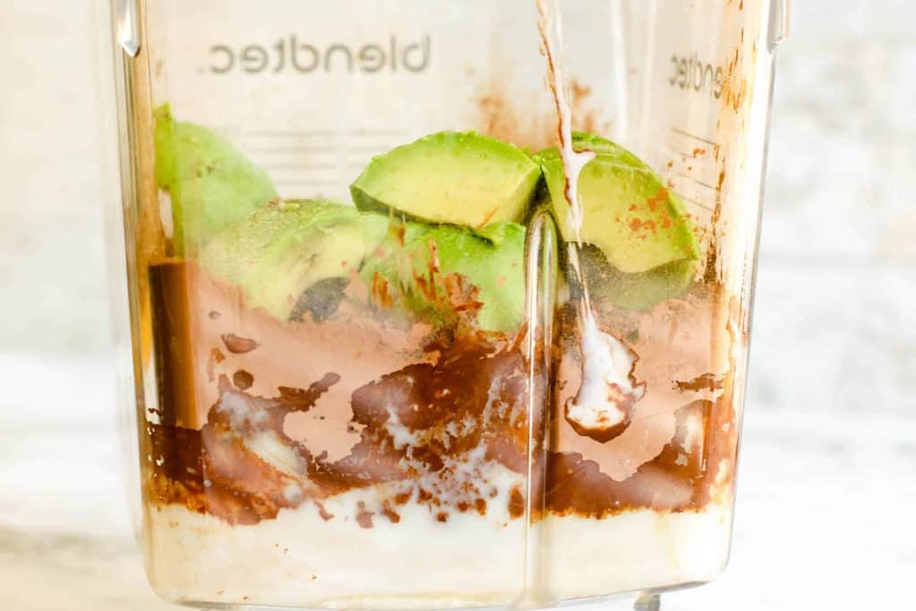 chocolate avocado ice cream ingredients in a blender.