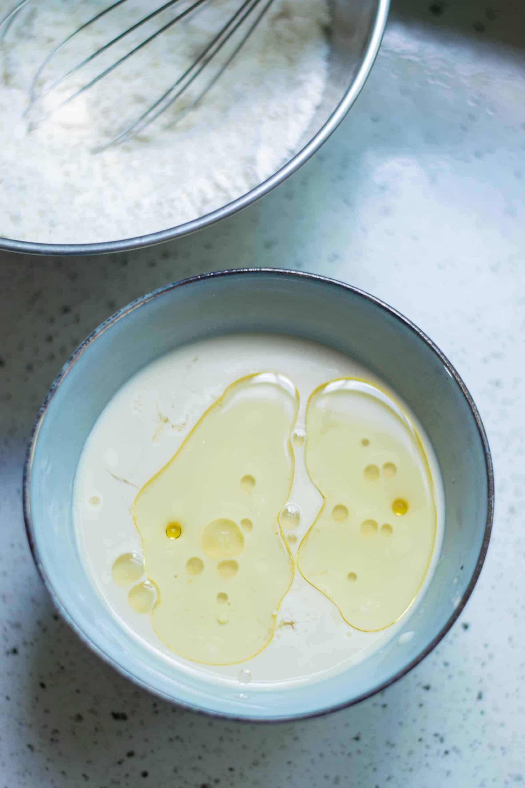 Curdled milk with oil on top.