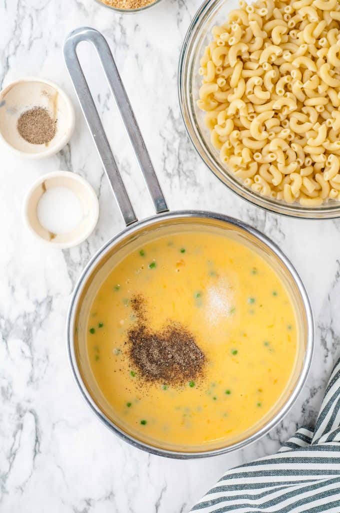 Salt and Pepper on top of butter and cheese sauce.