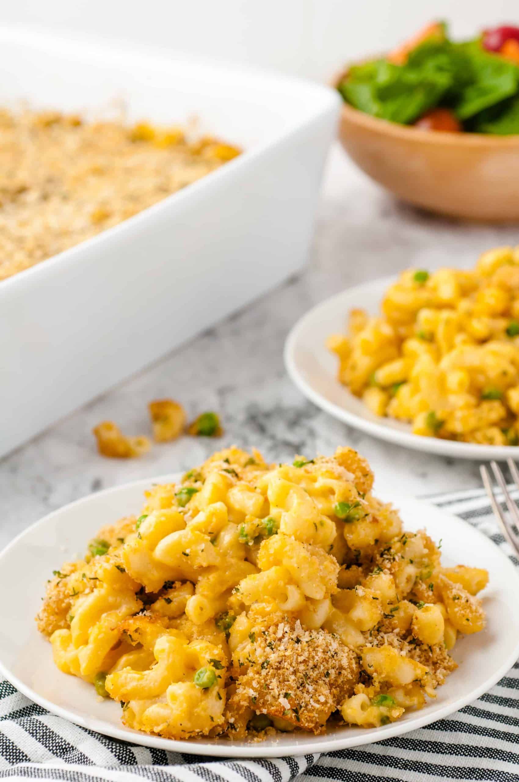 2 dishes of Mac and Cheese with Gouda served on white plates.