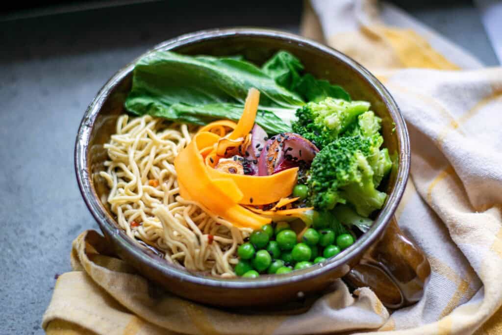 Ramen with Vegetables in a brown bowl.