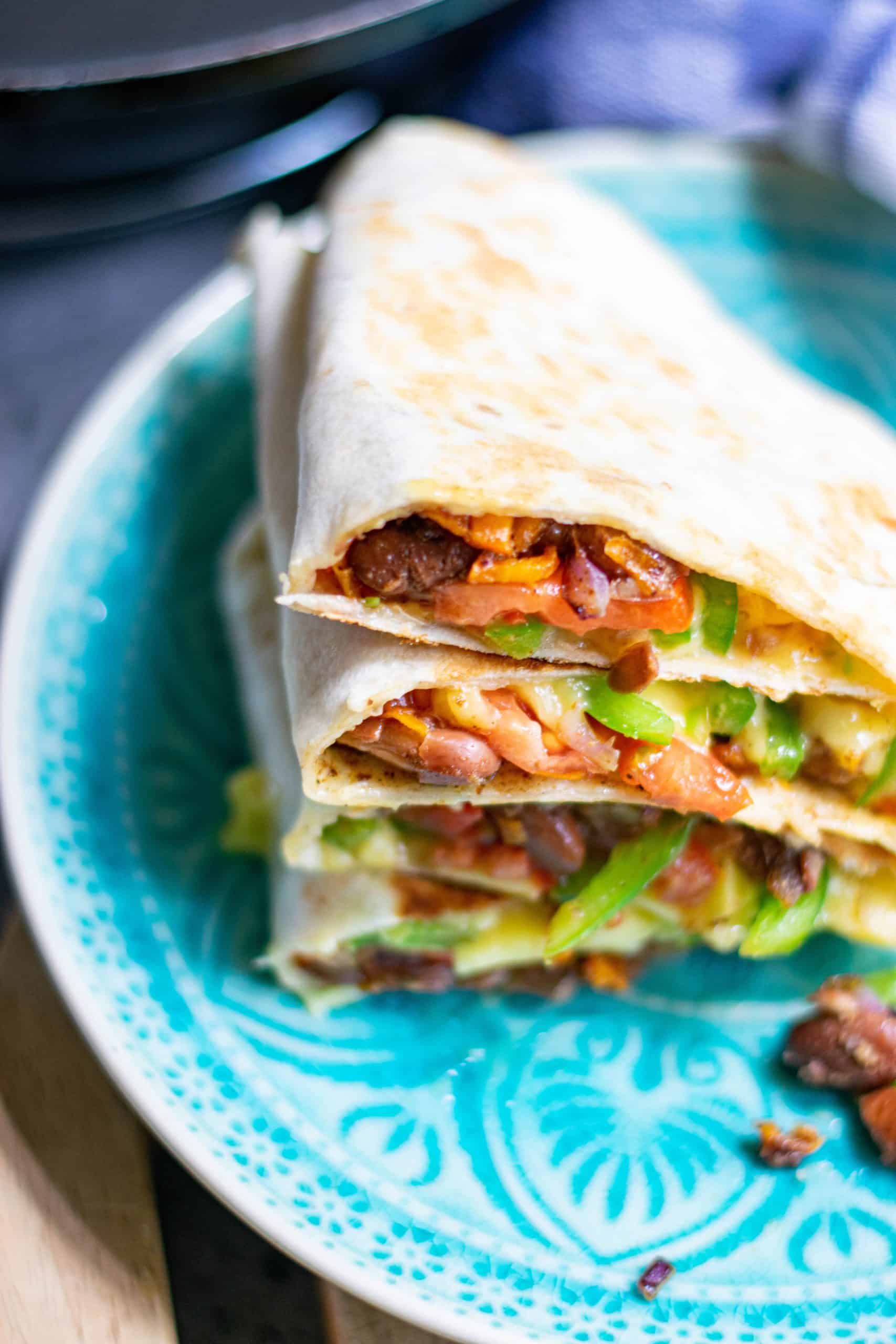 Vegan quesadillas on a blue plate.