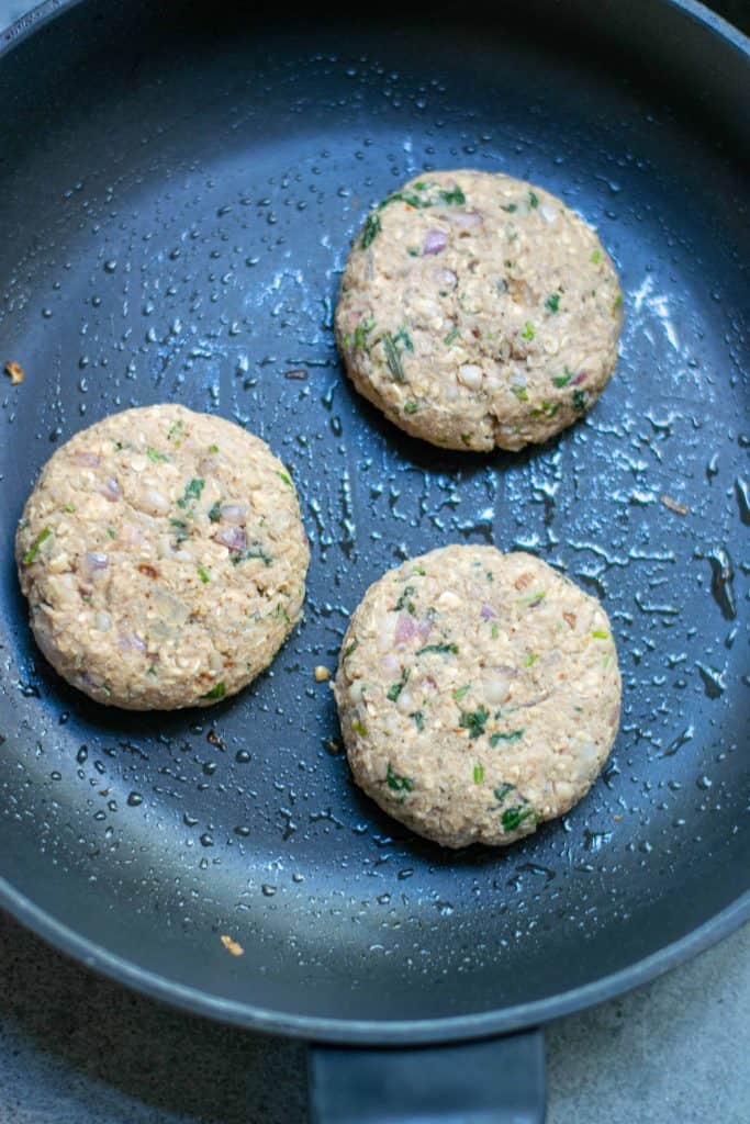 Vegan White Bean Burgers in a frying