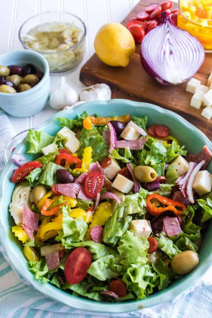 Tossed Antipasto Salad in a blue bowl