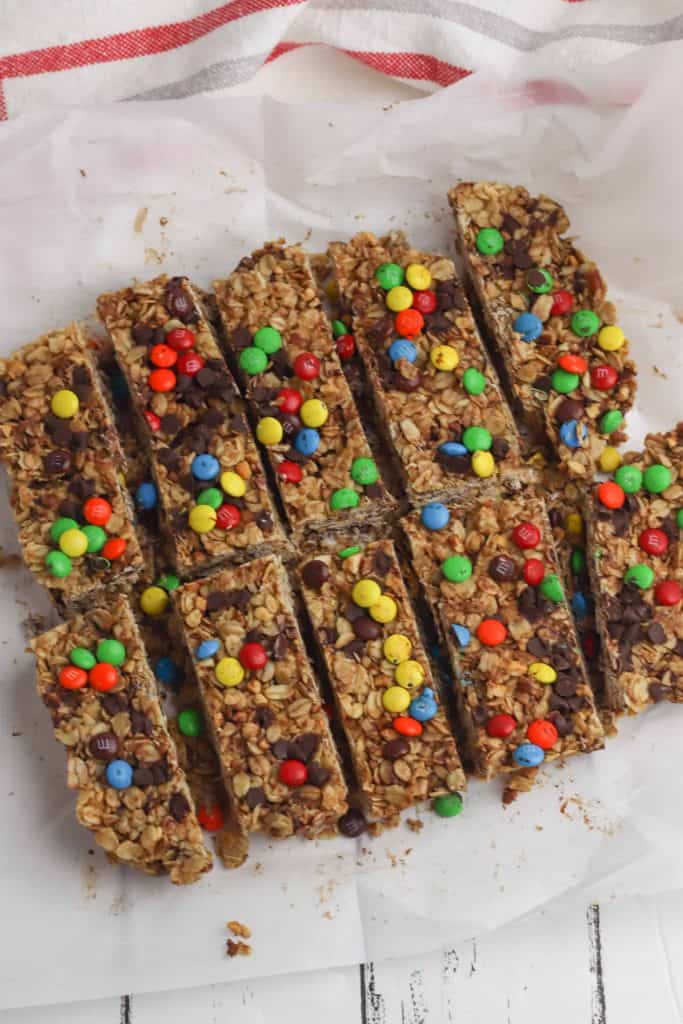 Chocolate Chip Granola cut into bars on parchment paper.
