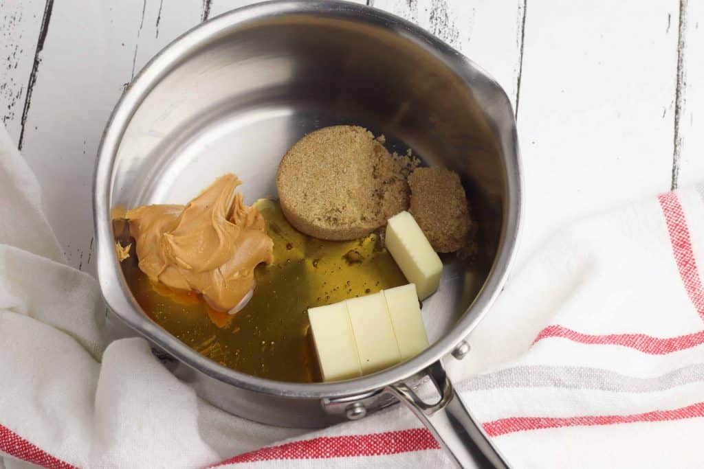 Peanut butter, brown sugar, and butter melting in a sauce pan.