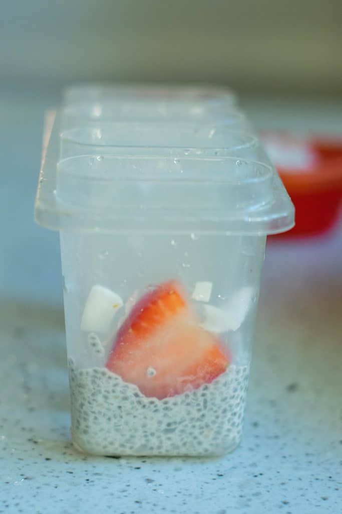 Chia seed pudding and strawberry in a popsicle mold.
