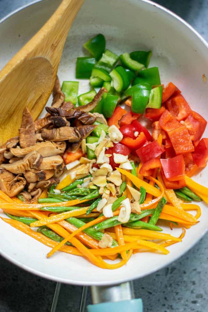 Vegetables in a saute pan.