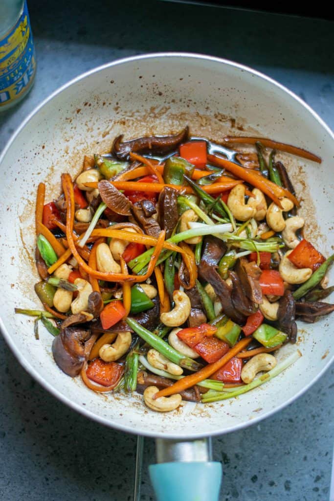 Overhead shot of Kung Pao Vegetables in a saut&eacute; pan.
