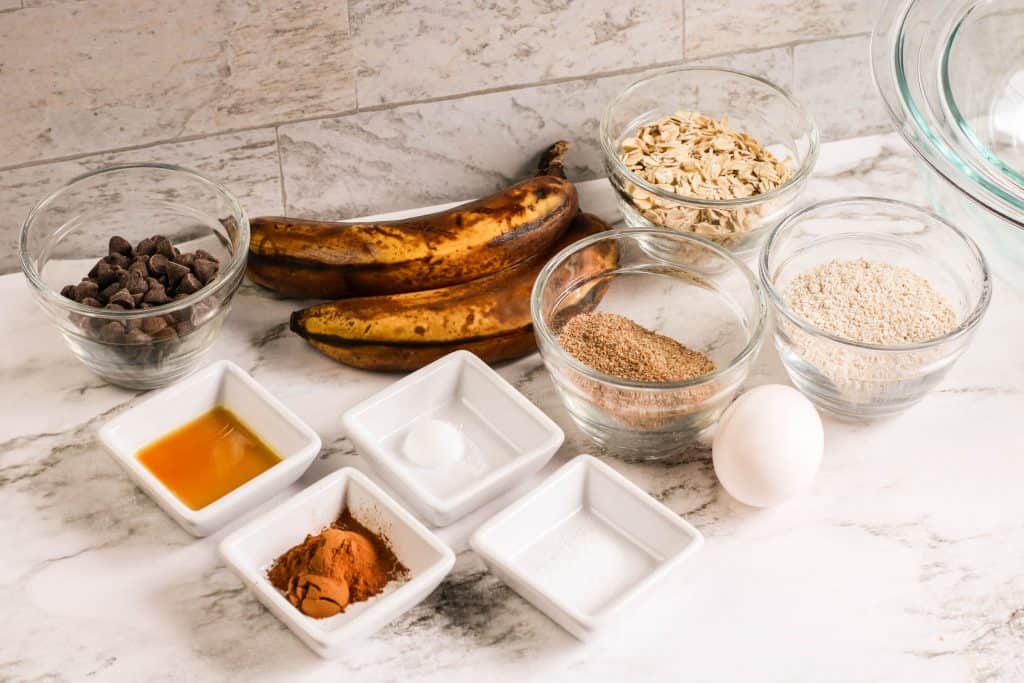 Ingredients for banana cookies on a marble counter top.