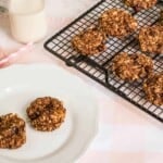 Banana Bread Cookies on a cooling rack and two on a white plate.