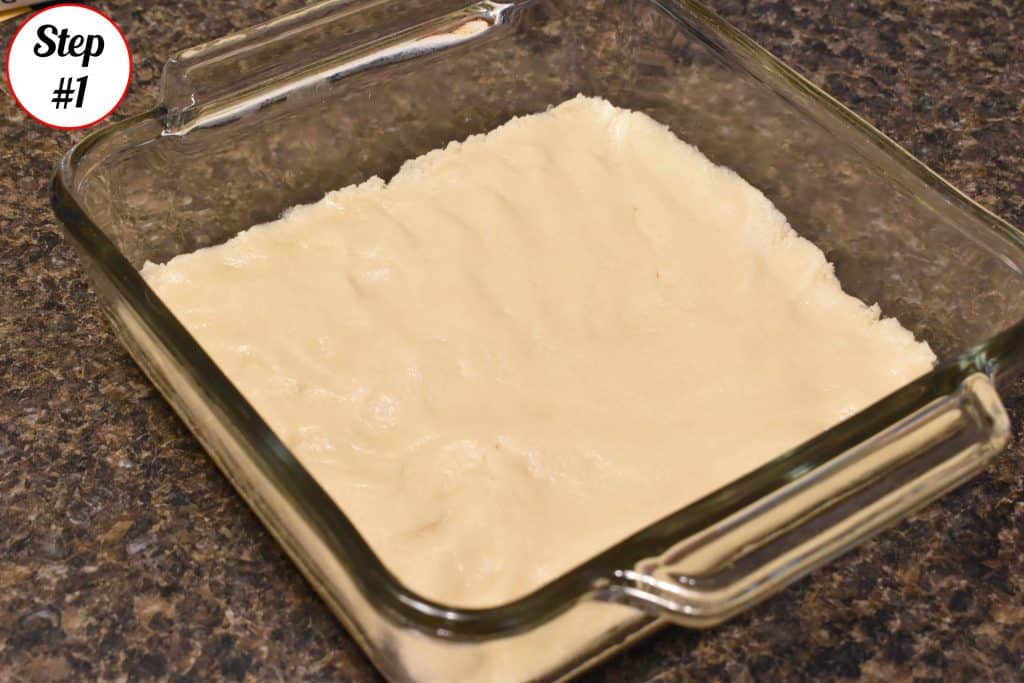 Cookie Dough Pressed into a glass baking dish.